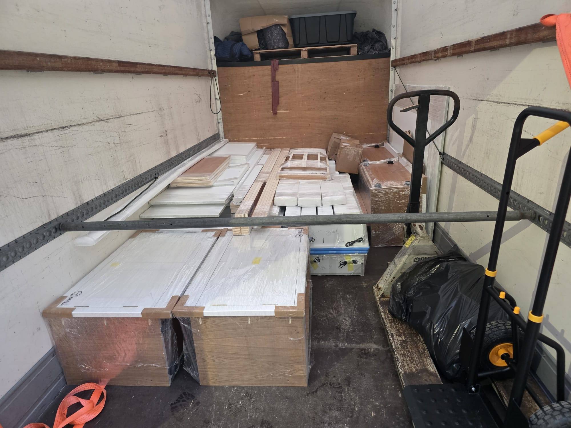Flat-packed furniture panels loaded in the van